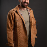Thumbnail of http://Bearded%20man%20smiling%20and%20wearing%20a%20tan%20corduroy%20shacket%20with%20ONX%20logo