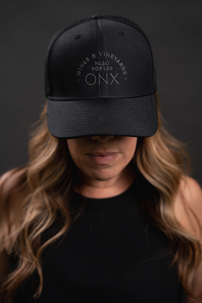 Image of http://Woman%20wearing%20black%20hat%20with%20ONX%20logo